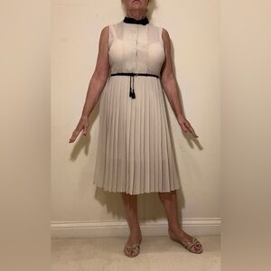 elegant blush pink Sleeveless Dress with black Peter Pan collar and belt